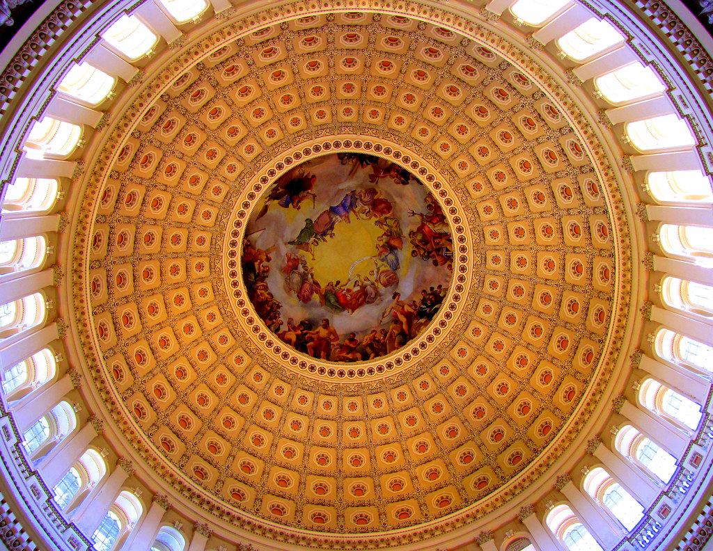 Looking up at the ornate coffered interior of the U.S. Capitol dome with a painted fresco at its center
