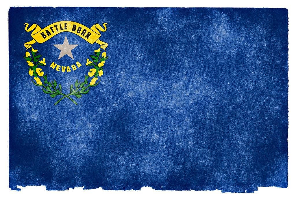 Nevada state flag with a silver star, sagebrush wreath and Battle Born banner on a textured blue background