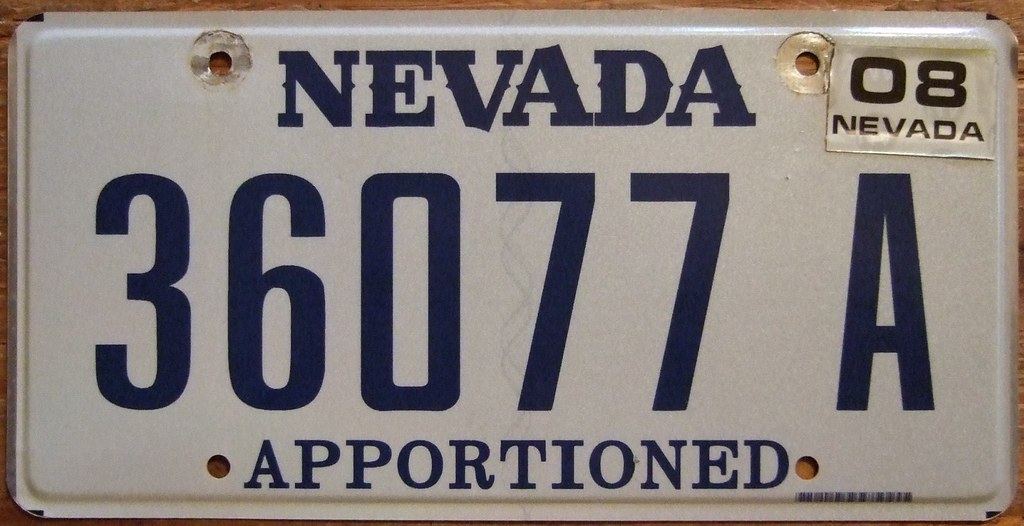 A white Nevada apportioned license plate with blue lettering and a 2008 registration sticker